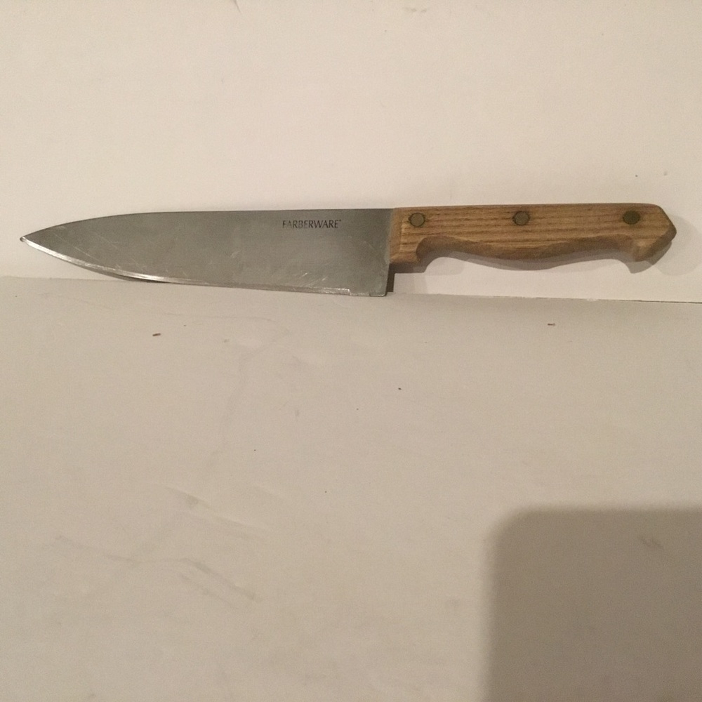 Carving knife. Farberware, stainless steelwith brown handle